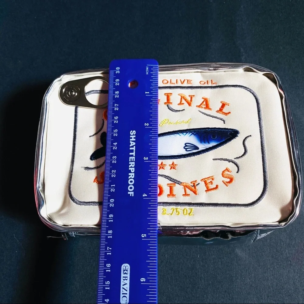 Campy and cute Sardine Can clutch cream & silver zip closure